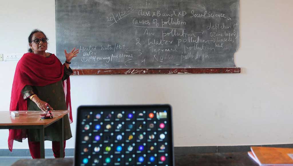 A teacher conducts an online class at a school in Kozhikode on Tuesday after local authorities closed all educational institutions in the district following an outbreak of Nipah.